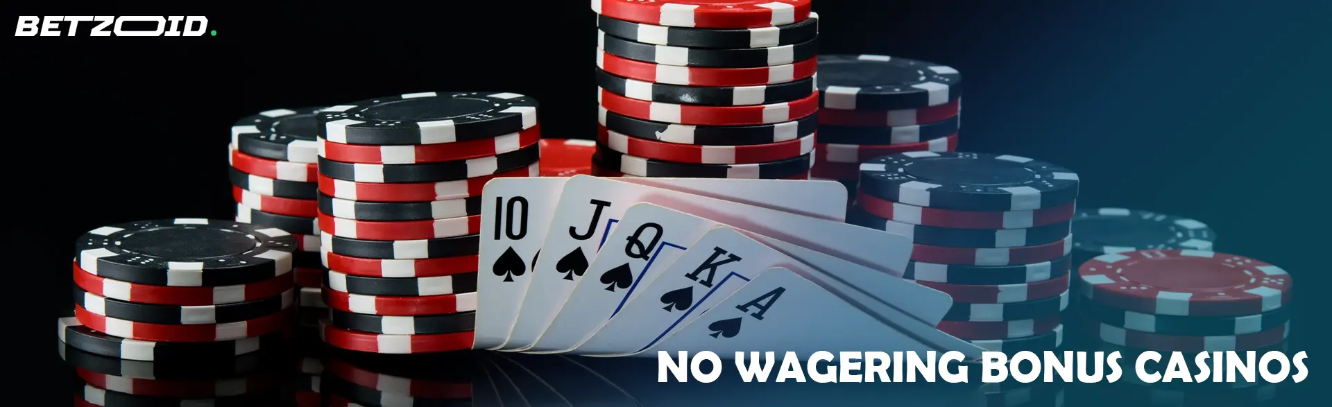 A pile of chips and cards on a dark background.