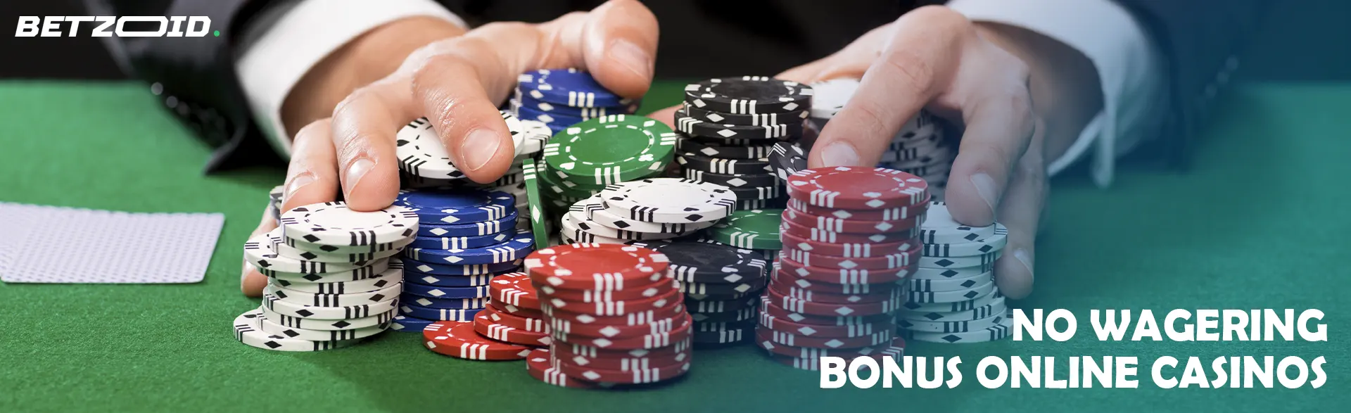 A player is holding a stack of chips on the casino table.