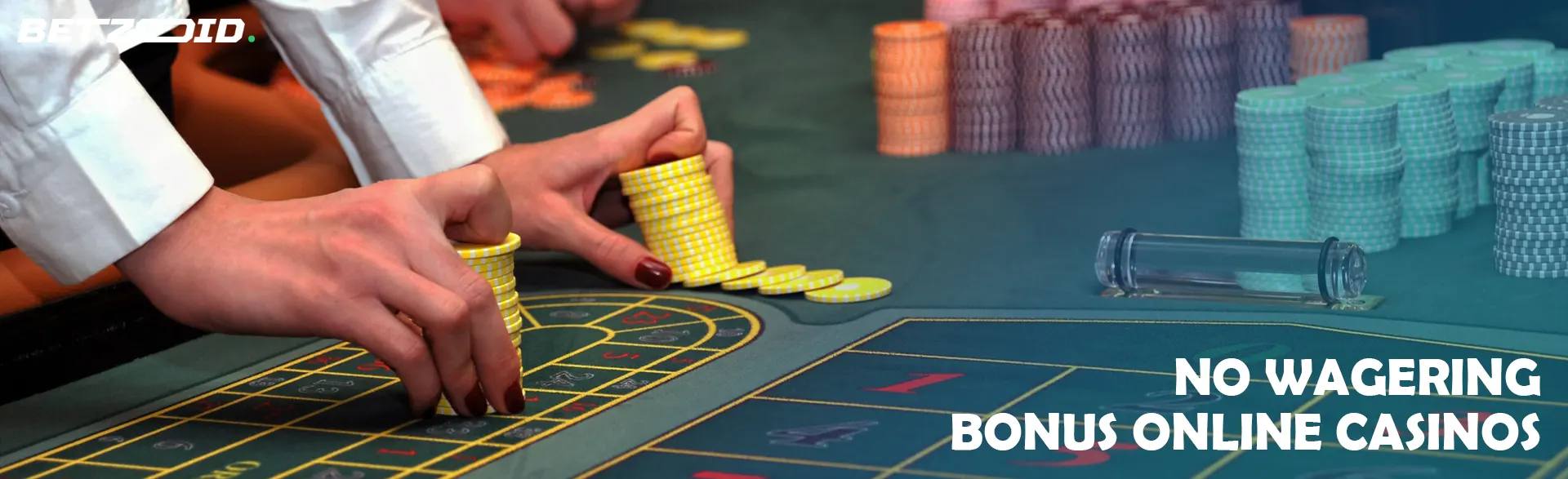 A player holds chips on the casino table.
