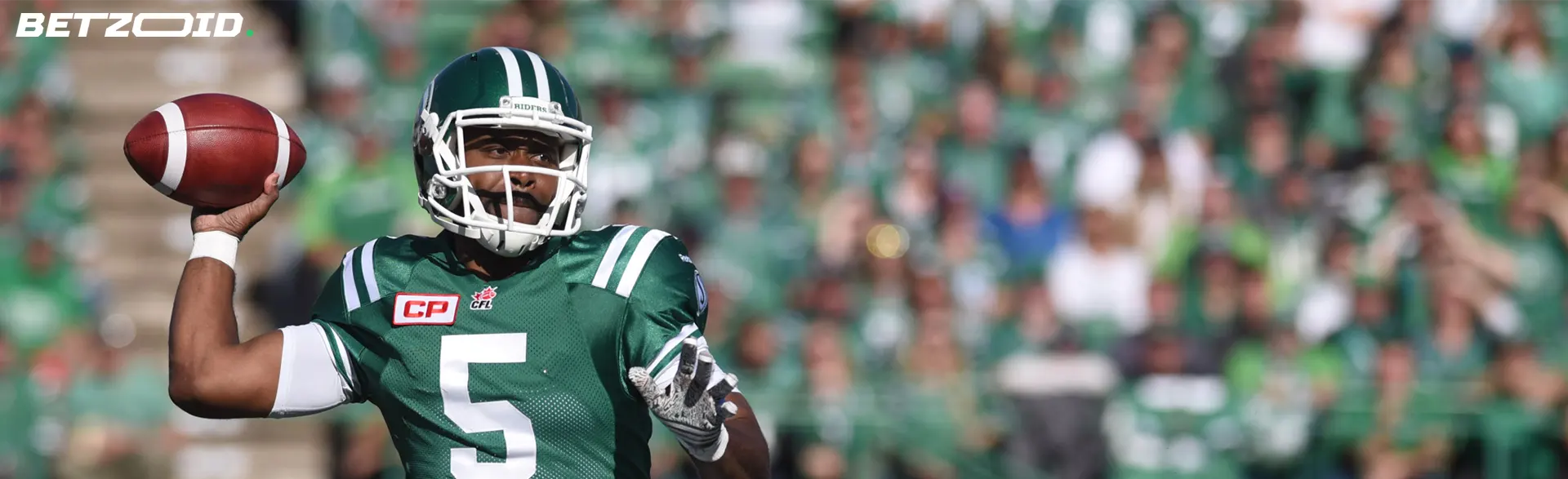 A focused football quarterback preparing to throw the ball, representing Northwest Territories sports betting sites.