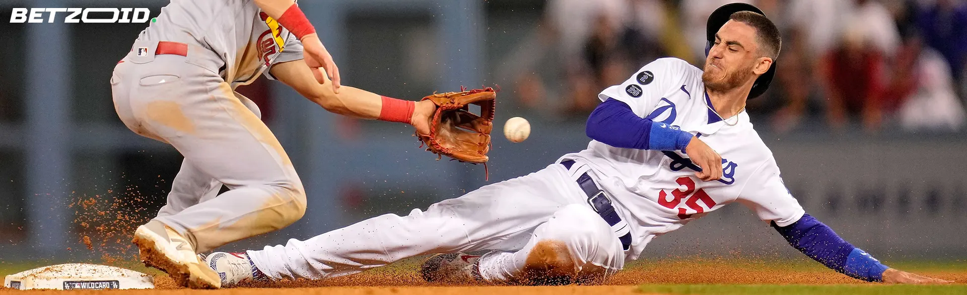 Baseball players in action during a slide, representing Nunavut sportsbooks.