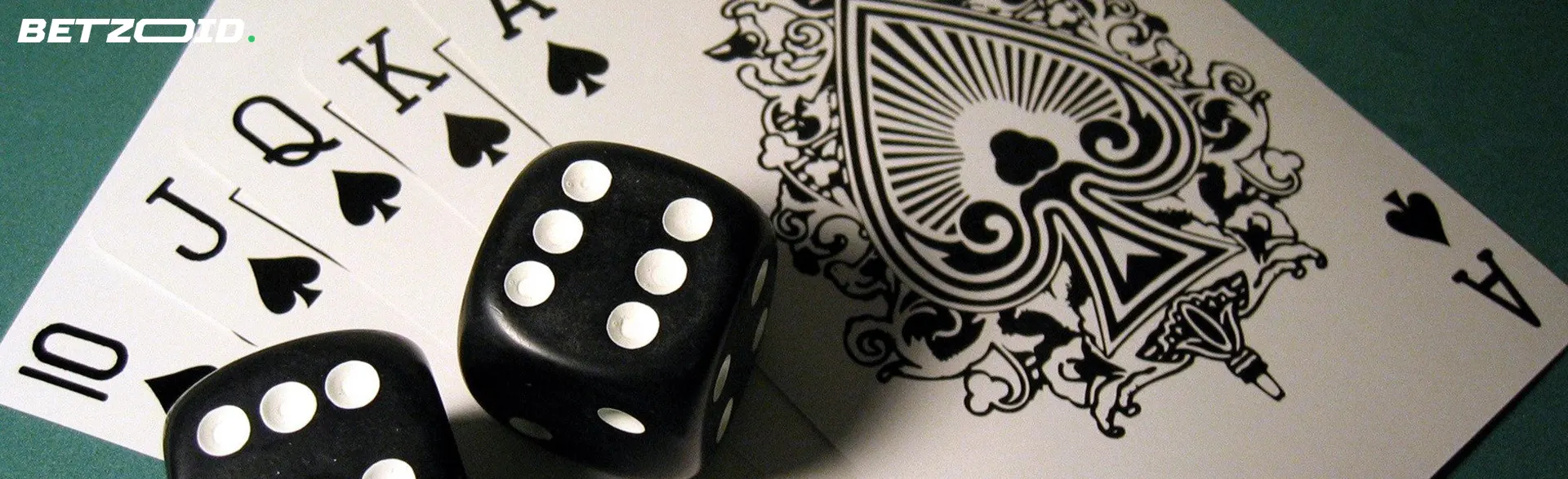 The dice lie on the playing cards.