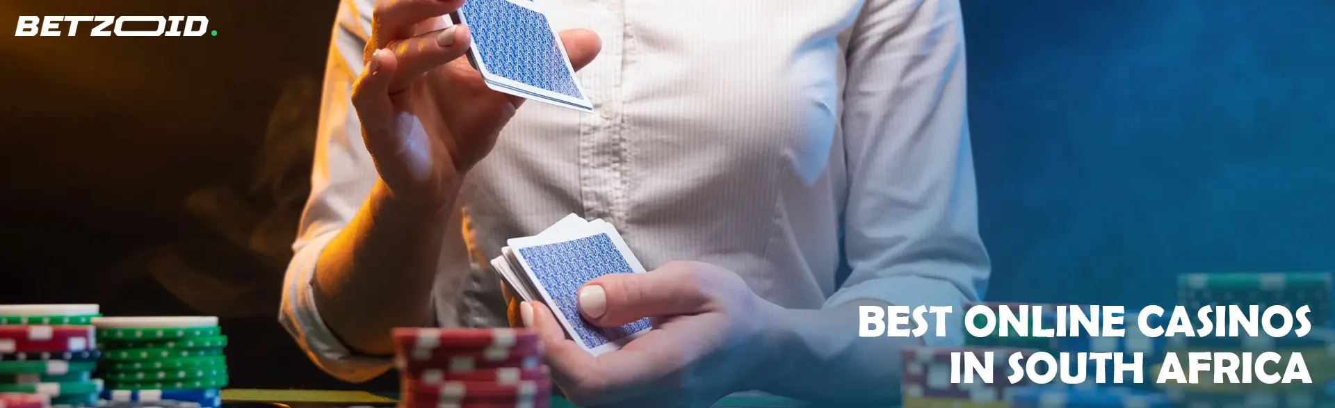 The player shuffles the cards next to the casino chips.