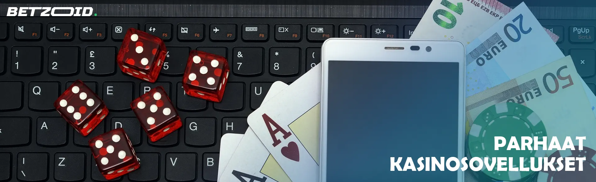 Näppäimistöllä on kortit, älypuhelin, noppaa ja kasinomerkkejä.