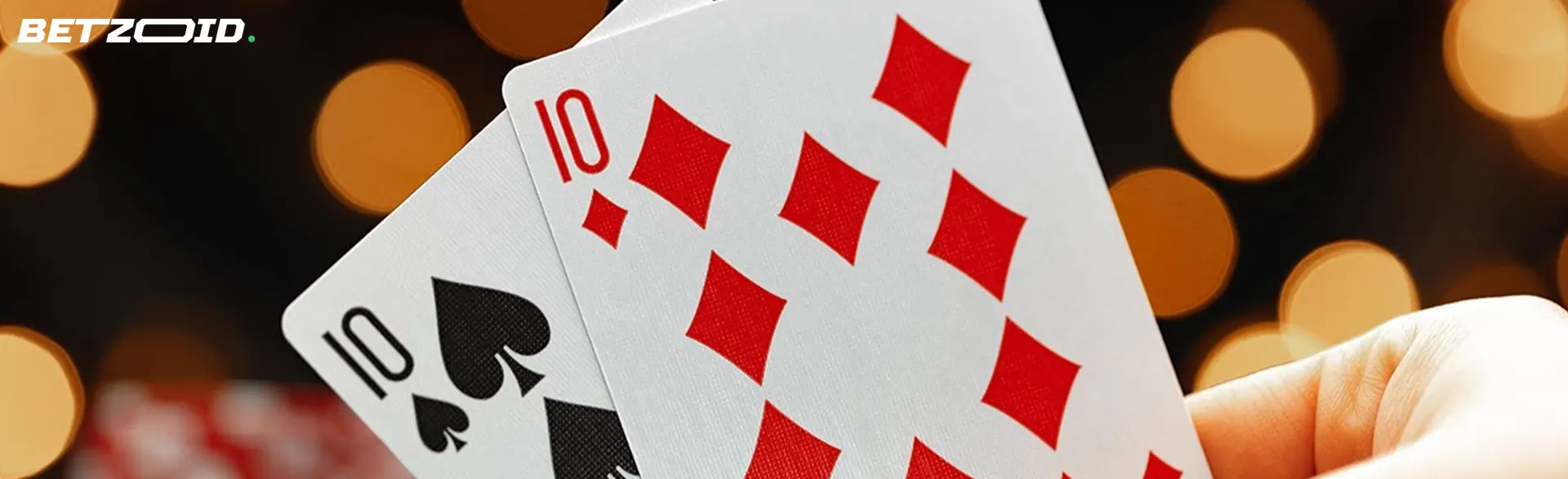 Two cards on the background of casino lights.