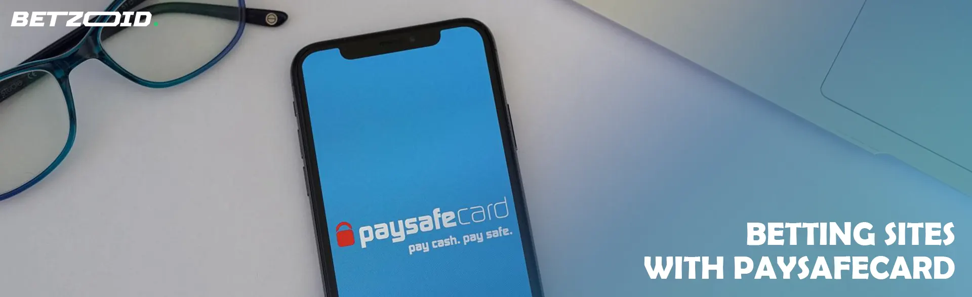 Smartphone with PaysafeCard logo on screen.