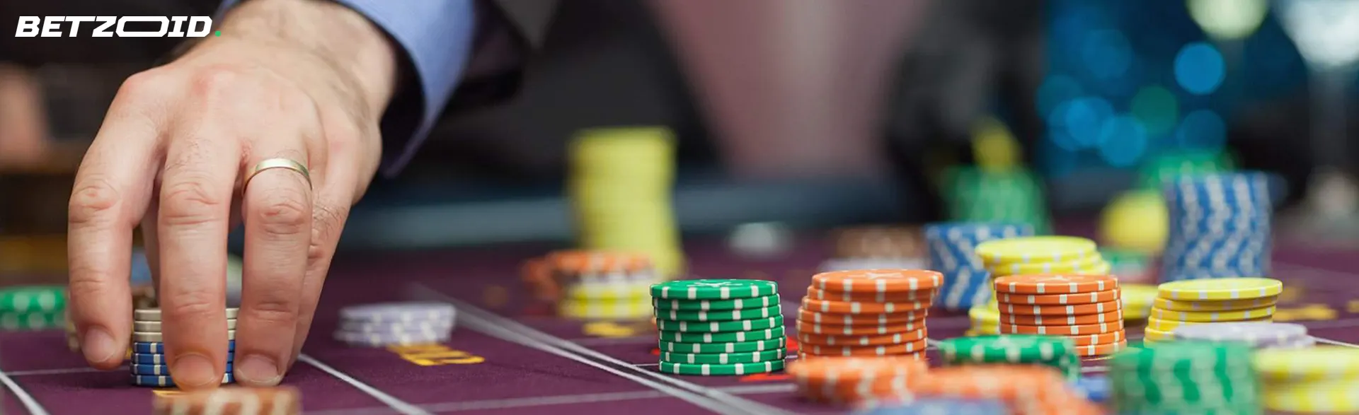 The player places chips on the casino table.