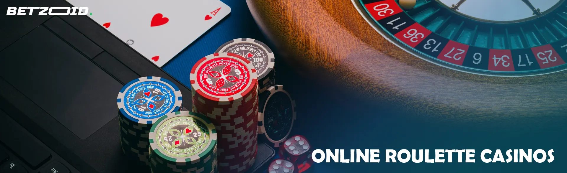 Roulette wheel and cards next to chips on keyboard.