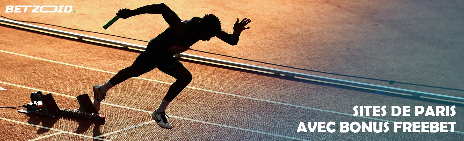 Le coureur démarre sur la piste.