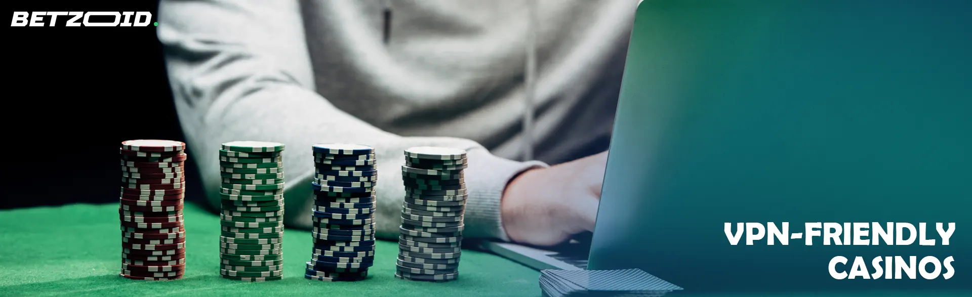 The player behind the laptop next to the casino chips.