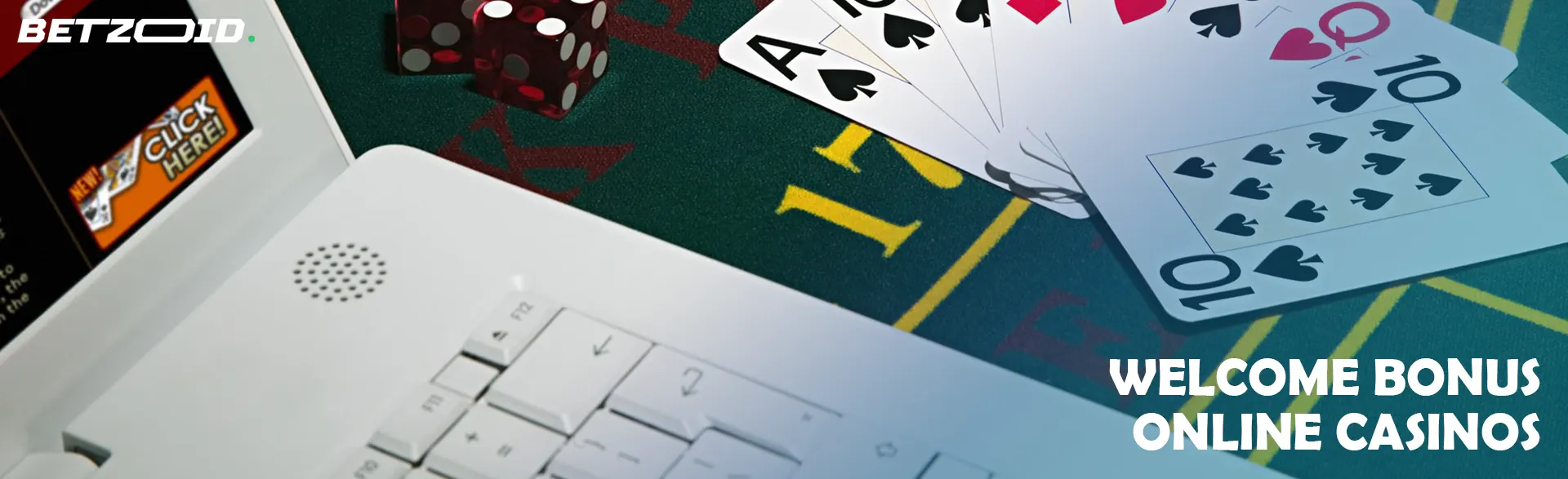 Cards and dice near the laptop.