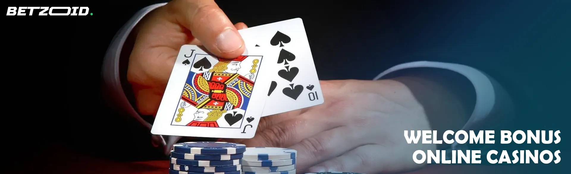 The player holds the cards next to the casino chips.