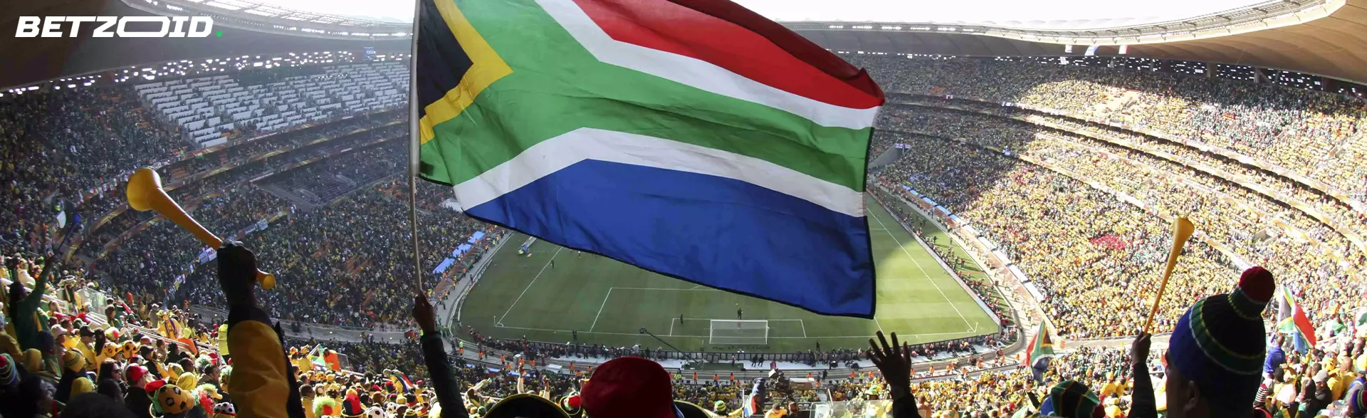 Stadium, fans with flag of South Africa.