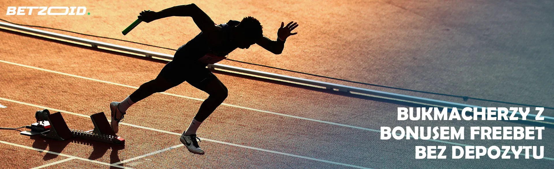 Biegacz startuje na bieżni.